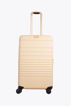 THE MEDIUM CHECK-IN ROLLER IN BEIGE