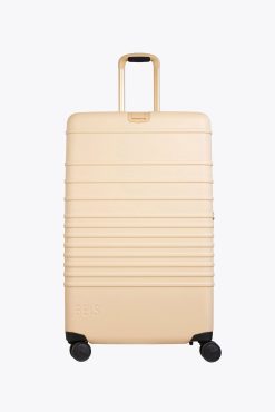 THE LARGE CHECK-IN ROLLER IN BEIGE